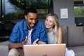 Couple enjoying video call on laptop, smiling and sitting on cozy sofa - PhotoDune Item for Sale