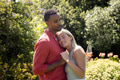 Couple embracing in garden, celebrating with champagne, feeling joyful and content - PhotoDune Item for Sale