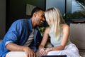 Couple laughing and enjoying quality time together on cozy living room sofa - PhotoDune Item for Sale