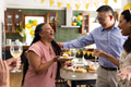 Celebrating birthday, senior friends with cake and wine in cozy home setting - PhotoDune Item for Sale