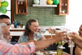 Toasting with wine glasses, senior friends celebrating joyful party at home - PhotoDune Item for Sale