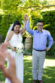 Celebrating senior wedding outdoors, senior couple holding hands and smiling in garden - PhotoDune Item for Sale