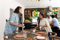 Seniors in modern kitchen preparing table for celebration, talking together - PhotoDune Item for Sale