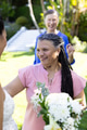 Celebrating with friends, senior woman holding bouquet at garden event outdoors - PhotoDune Item for Sale