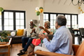 Celebrating together at home, elderly friends clapping in festive atmosphere - PhotoDune Item for Sale