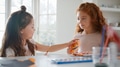 Two Girls At Home Having Fun Making Craft Halloween Decorations Together - PhotoDune Item for Sale