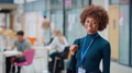 Portrait Of Smiling Female College Student In Busy Communal Campus Building - PhotoDune Item for Sale