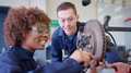 Male And Female Students Working On Car Brakes On Auto Mechanic Apprenticeship Course At College - PhotoDune Item for Sale