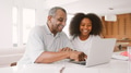 Teenage Girl Helping Grandfather To Use Laptop At Home - PhotoDune Item for Sale