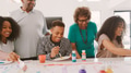 Grandparents With Adult Grandchildren Doing Craft At Home Together - PhotoDune Item for Sale