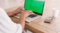 Close Up Of Senior Man Sitting At Table Using Green Screen Laptop - PhotoDune Item for Sale