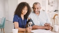 Female Nurse Taking Senior Man's Blood Pressure On Home Visit - PhotoDune Item for Sale