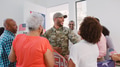 Multi Generation Family Greeting Soldier Husband In Uniform Visiting Home On Leave - PhotoDune Item for Sale