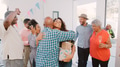 People Hugging As They Arrive At Multi Generation Family House Party - PhotoDune Item for Sale
