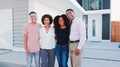 Portrait Of Smiling Family With Older Children Standing In Front Of House - PhotoDune Item for Sale