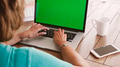 Close Up Of Senior Woman Sitting At Table Using Green Screen Laptop - PhotoDune Item for Sale