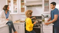 Daughter Preparing Meal in Kitchen Watched By Parents - PhotoDune Item for Sale