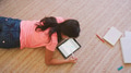 Overhead Shot Of Young Girl Lying On Floor in Lounge At Home Drawing With Stylus On Digital Tablet - PhotoDune Item for Sale