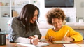 Grandmother And Granddaughter Sitting At Table At Home Drawing Picture On Digital Tablet With Stylus - PhotoDune Item for Sale