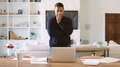 Mature Man In Thought Standing At Table At Home Reviewing Finances On Laptop - PhotoDune Item for Sale