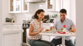 Couple In Kitchen Sitting At Table Eating Meal Together - PhotoDune Item for Sale