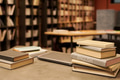 Stack of English Language Books Arranged on Table in Library Setting - PhotoDune Item for Sale