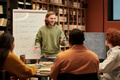 Young Man Teaching Multiethnic People Spanish Language in Classroom - PhotoDune Item for Sale