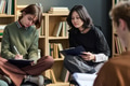 Teenage Girls Collaborating and Writing Notes during Group Therapy Session - PhotoDune Item for Sale
