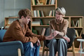 Adult Woman Supporting Teenager during Group Therapy - PhotoDune Item for Sale