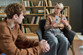 Young Woman Leading Group Therapy Session with Teenager - PhotoDune Item for Sale