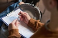 Young Woman Preparing Mental Health Group Therapy Registration Form - PhotoDune Item for Sale