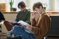 Teenage Boys Participating in Group Therapy Session and Reading Handouts - PhotoDune Item for Sale