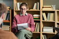 Young Man Leading Group Therapy Session with Diverse Participants - PhotoDune Item for Sale
