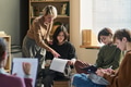 Adult Woman Leading Diverse Young People in Group Therapy Session - PhotoDune Item for Sale