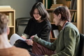 Young Multiethnic Women Sharing Experiences during Group Therapy Session - PhotoDune Item for Sale