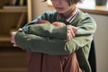 Teenage Girl Sitting with Knees up during Group Therapy Session - PhotoDune Item for Sale