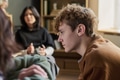 Teenage Boy Listening Attentively during Group Therapy Session - PhotoDune Item for Sale