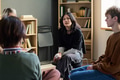 Diverse Young People Participating in Group Therapy Session and Listening - PhotoDune Item for Sale