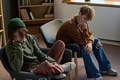 Two Teenagers Sitting in Group Therapy Session Appearing Thoughtful - PhotoDune Item for Sale