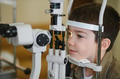 Child undergoing vision diagnostics with ophthalmologist in clinic - PhotoDune Item for Sale