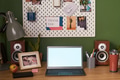 Home Office Workspace Featuring Laptop and Personal Items on Wooden Desk - PhotoDune Item for Sale
