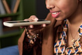 Young Indian Woman Using Smartphone Voice Assistant for Communication - PhotoDune Item for Sale