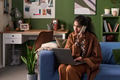 Young South Asian Woman Working Remotely Using Laptop and Phone - PhotoDune Item for Sale