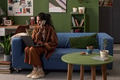 Young South Asian Woman Working Remotely While Talking on Smartphone - PhotoDune Item for Sale
