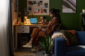Young South Asian Woman Analyzing Financial Documents at Home Workspace - PhotoDune Item for Sale
