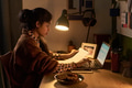 Young South Asian Woman Working Remotely with Documents at Desk - PhotoDune Item for Sale