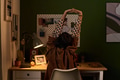 Young Woman Stretching Arms While Sitting at Desk Working - PhotoDune Item for Sale