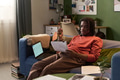 Young Black Man Reviewing Documents While Working Remotely from Home - PhotoDune Item for Sale