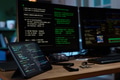 Close up of Tablet and Monitors Displaying Programming Code in Office - PhotoDune Item for Sale