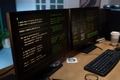 Close up of Computer Monitors Displaying Surveillance Camera Code Running - PhotoDune Item for Sale
